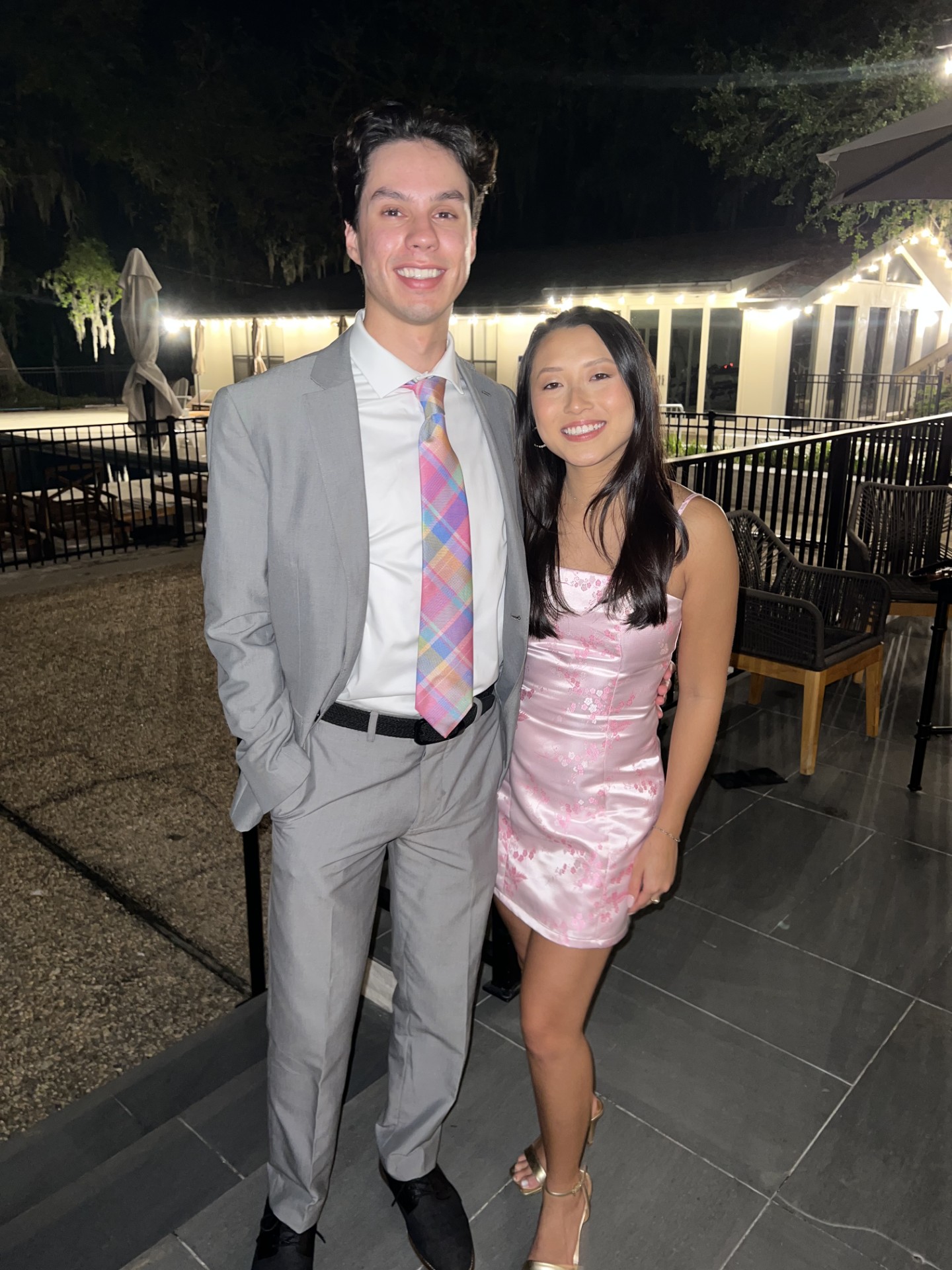 Emily and Matthew dressed up for a wedding celebration